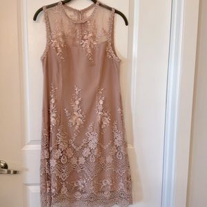 has lots of lace detailing size 6 has a small stain on the inside of the dress